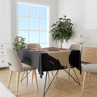 Black tablecloth with unity graphic, draped over dining table
