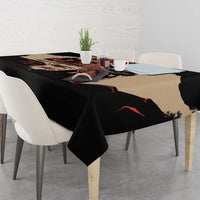Black tablecloth with bold illustrated unity design on tabletop corner