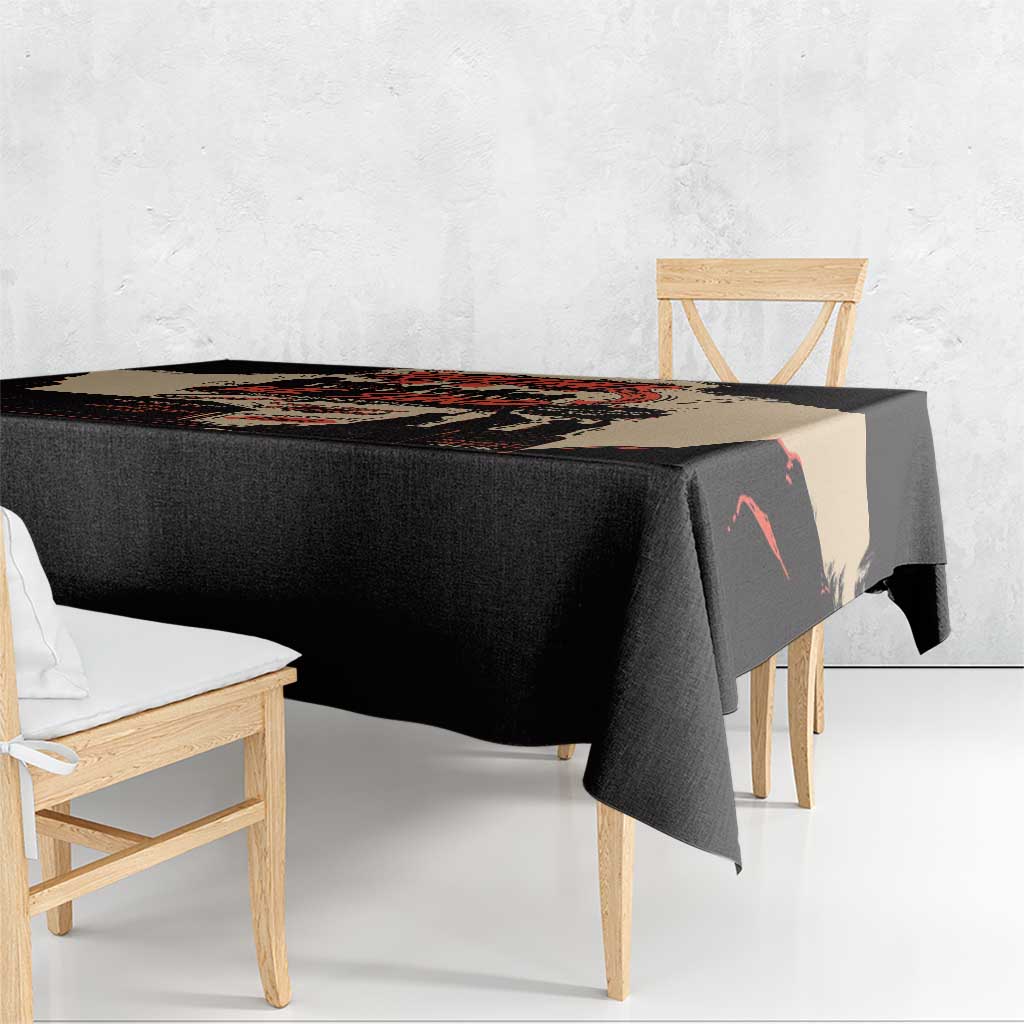 Black tablecloth with illustrated unity band, hanging over table edge