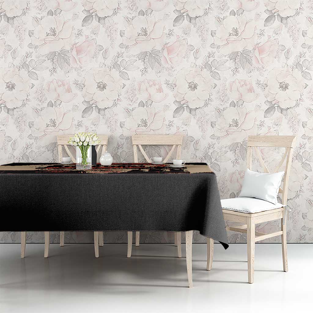 Black tablecloth with central unity artwork, dining table set with chairs