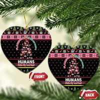 Black heart-shaped ceramic Christmas ornaments with Flamingo Humans graphic; gold loop; Front/Back