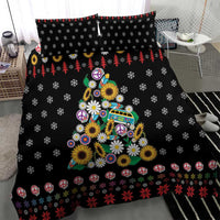 Black Christmas bedding with peace signs, colorful flower tree and repeating snowflake motifs.