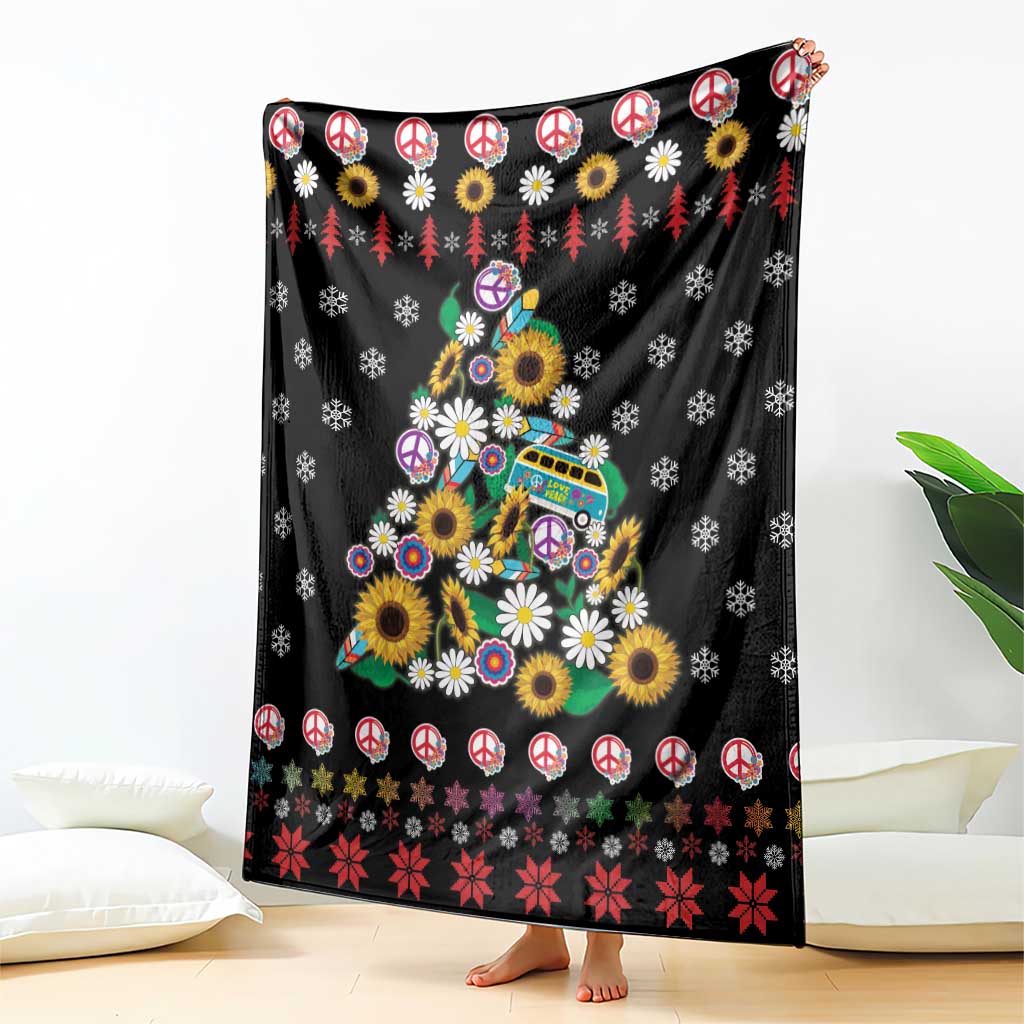 Black blanket featuring peace signs, flowers, and Christmas tree scene with red accents