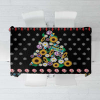 Black Christmas tablecloth with colorful peace symbols, flowers, and holiday motifs