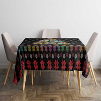 Black Christmas tablecloth with red leaf pattern and colorful peace symbols on center