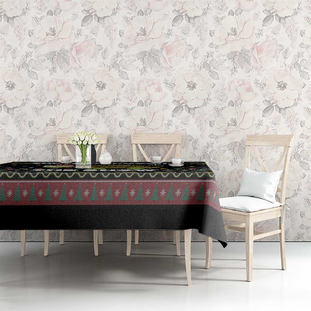 Black tablecloth with green pine tree stripe and turtle snowflake border