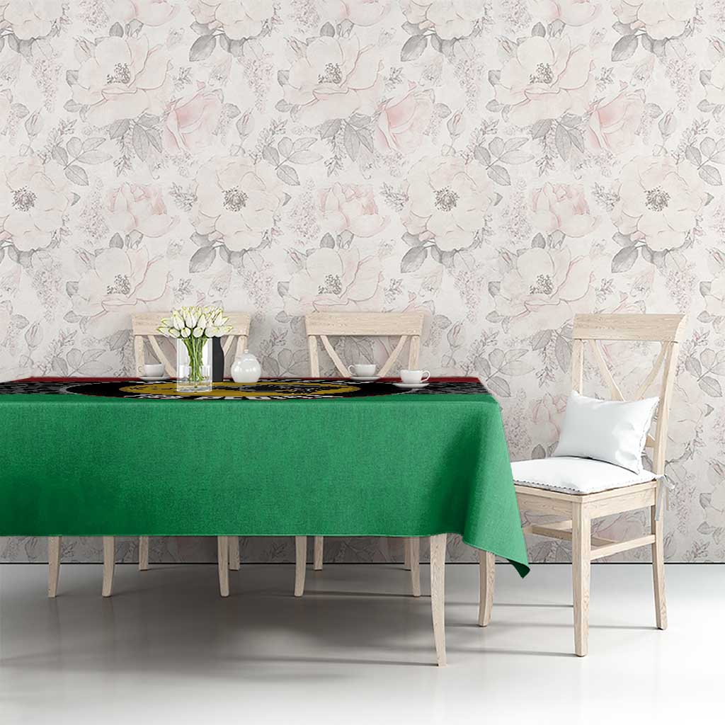 Panther tablecloth with green center and black leopard print strip across the top