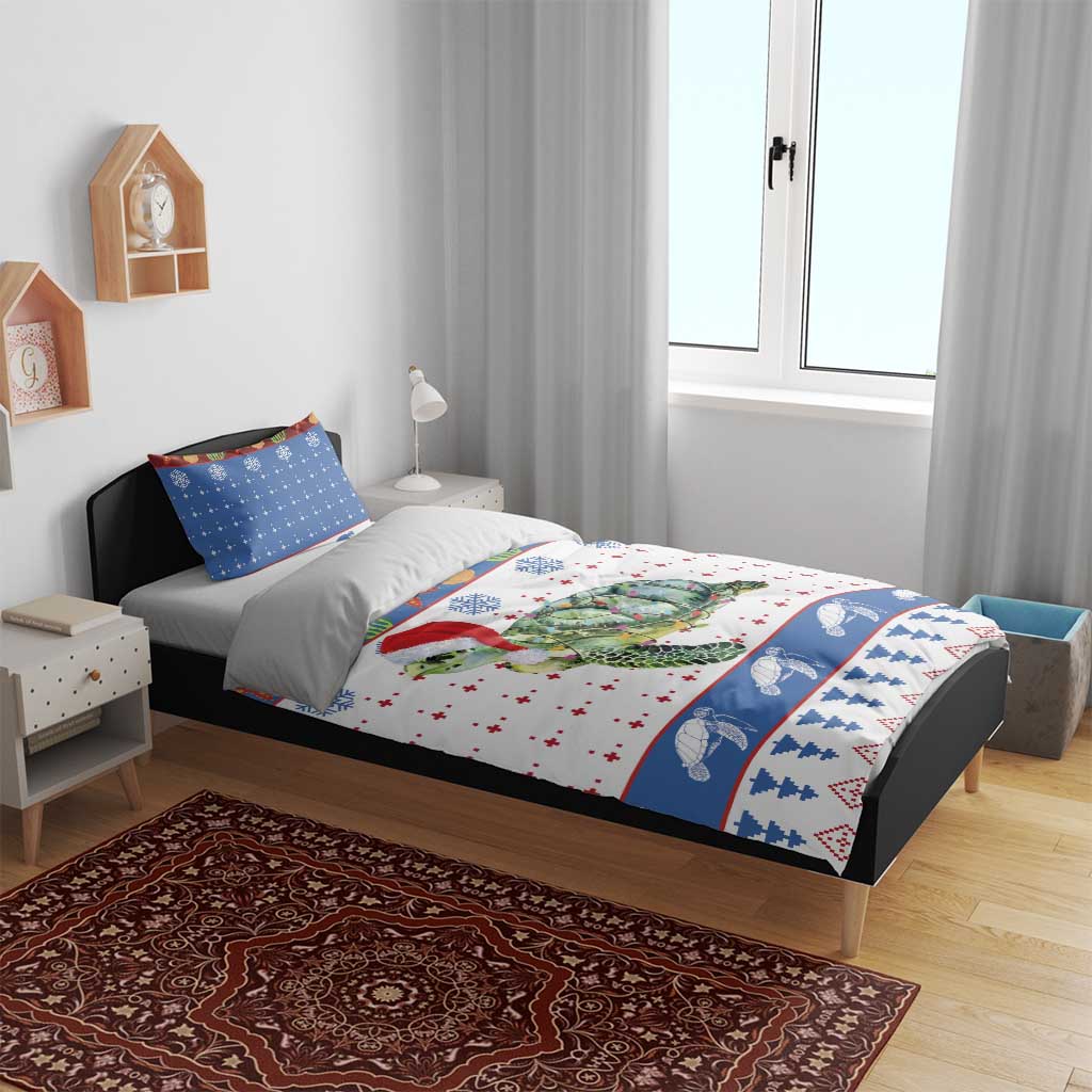 Christmas turtle bedding set on bed: white duvet with Santa-hat sea turtle and blue edge print