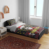 Black skull Santa bedding set on bed with “Have a Rad Christmas” design and hazard patterns.