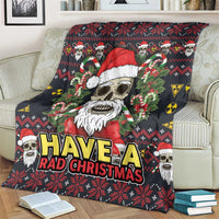 Christmas blanket on couch with skull Santa and red hat, candy canes, and 'HAVE A RAD CHRISTMAS'