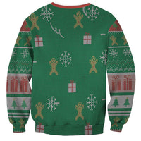 Green unisex sweatshirt with all-over Christmas pattern: gifts, trees, and figures