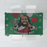 Green tablecloth with illustrated Jesus and red “BIRTHDAY BOY” lettering