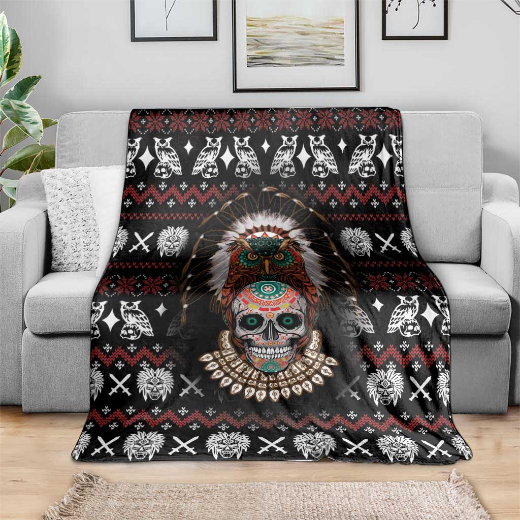 Black skull warrior blanket with headdress on couch, white animal icons and red diamond pattern