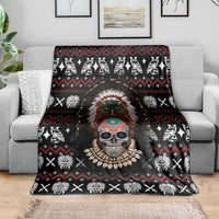 Black skull warrior blanket with headdress on couch, white animal icons and red diamond pattern