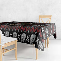 Black tablecloth with red and white tribal skull and feather motifs, draped edge