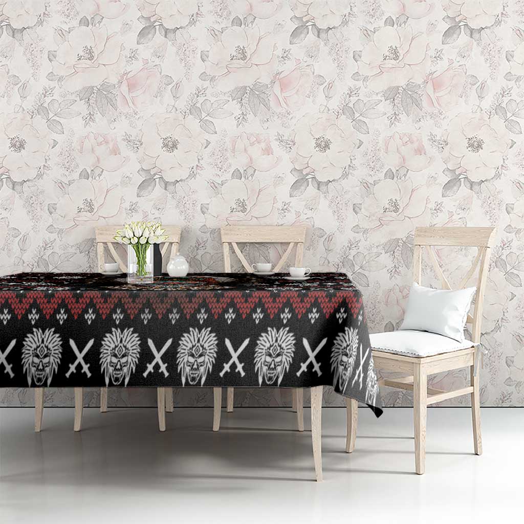 Black tablecloth with red and white tribal skull border pattern across dining table