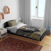 Crowned lion dark gray bedding set on bed with gold speckle print and matching pillows