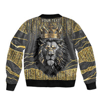 Dark gray bomber jacket back with gold crown and lion, 'YOUR TEXT' across shoulders