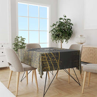 Black and gold lion tablecloth draped over dining table with gold speckled design