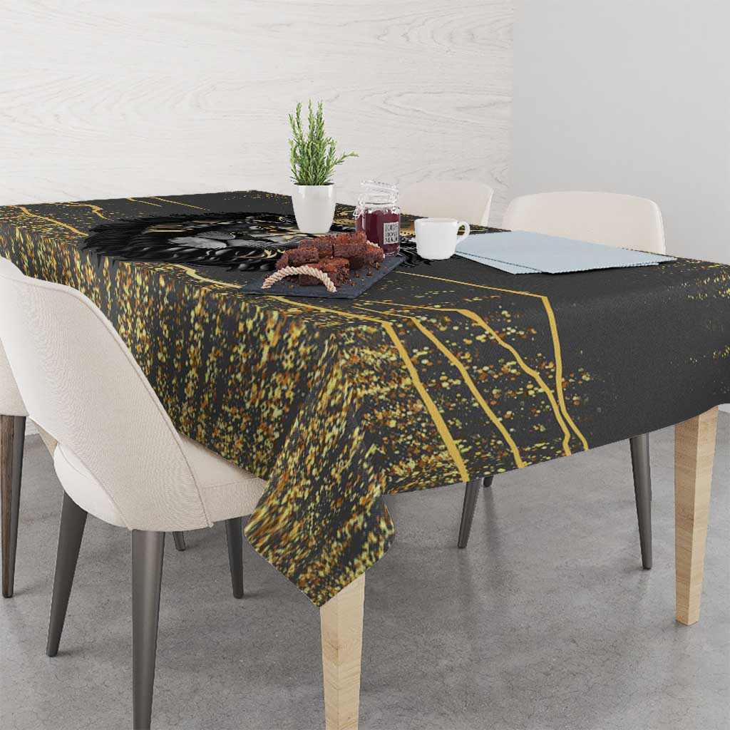 Black and gold lion tablecloth with gold graphic border and speckled texture