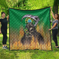 Green quilt blanket with black edge trim and skull reaper graphic over Brazilian crest