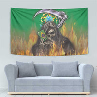 Green tapestry with grim reaper skull and Brazilian flag, surrounded by orange fire