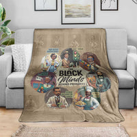 Beige throw blanket on gray sofa, colorful portraits in center design