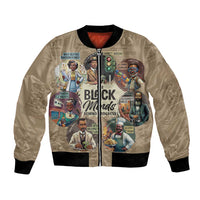 Beige bomber jacket with black rib trim and colorful front graphic, full-zip