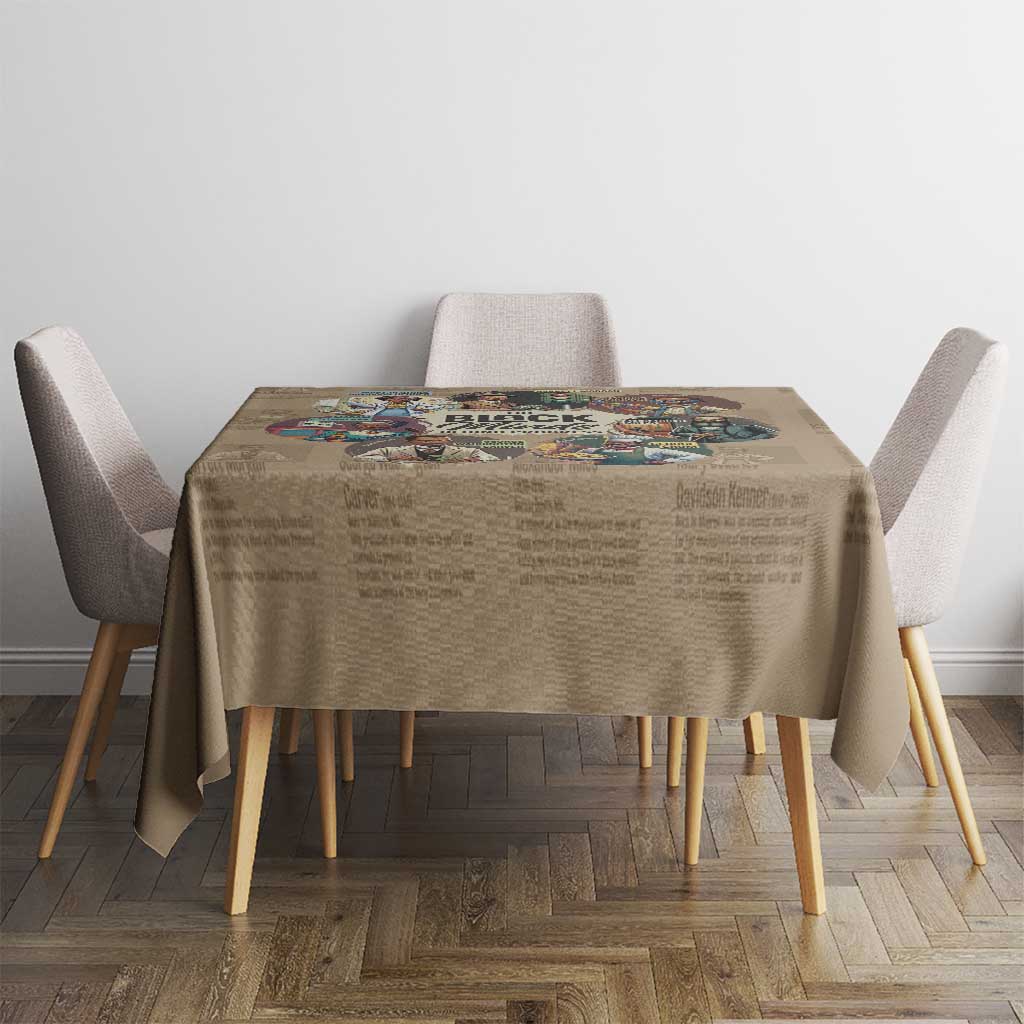 Beige printed tablecloth on a dining table, featuring a central colorful collage graphic.