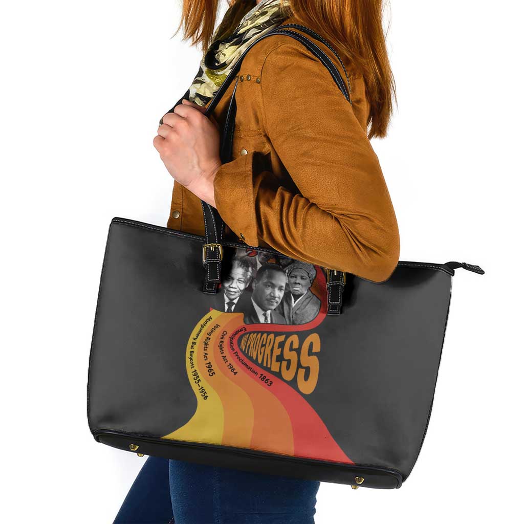 Black leather tote bag with colorful Civil Rights Leaders graphic, open top handles