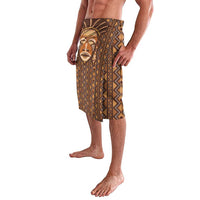 Printed mudcloth lavalava featuring a mask portrait panel and zigzag trim, brown