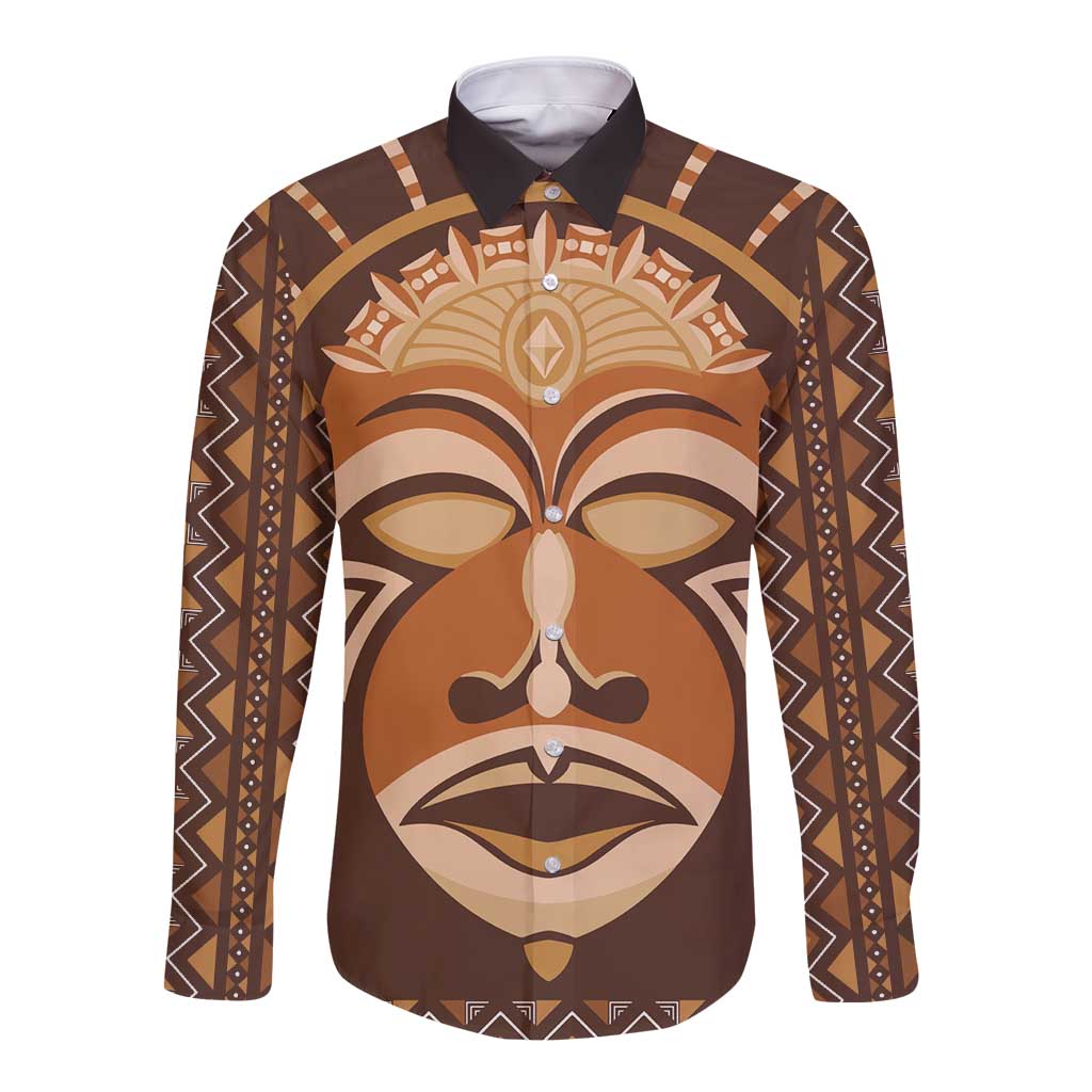 Brown long-sleeve button-up shirt with tribal face graphic