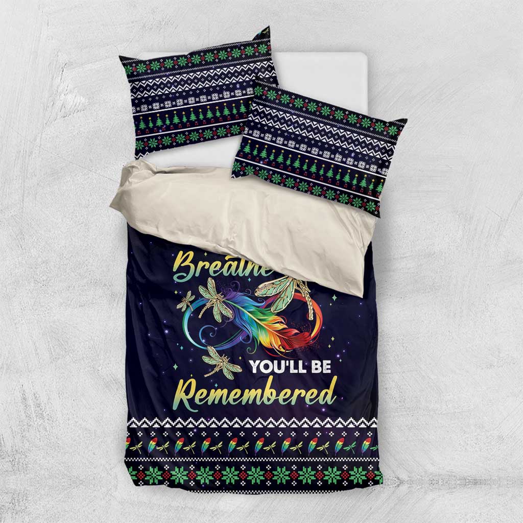 Navy duvet cover and two pillowcases with dragonfly angel graphic and decorative border