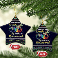 Dark blue star-shaped ceramic ornaments with gold hanging loops, dragonfly art and remembrance message.
