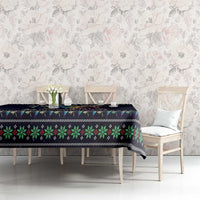 Dark navy tablecloth with green and red folk-style stripe border and angel dragonfly theme