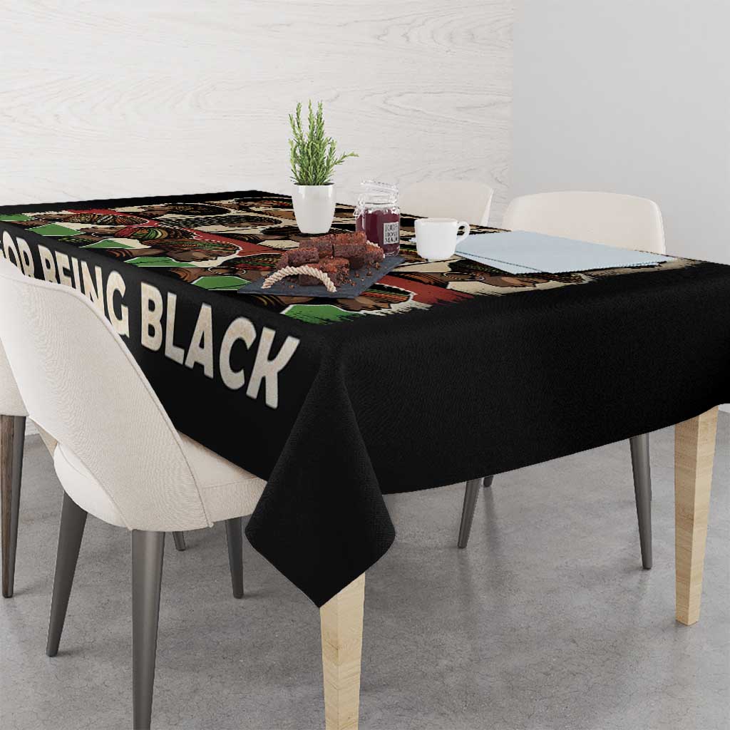Black tablecloth on table with 'FOR BEING BLACK' text in white