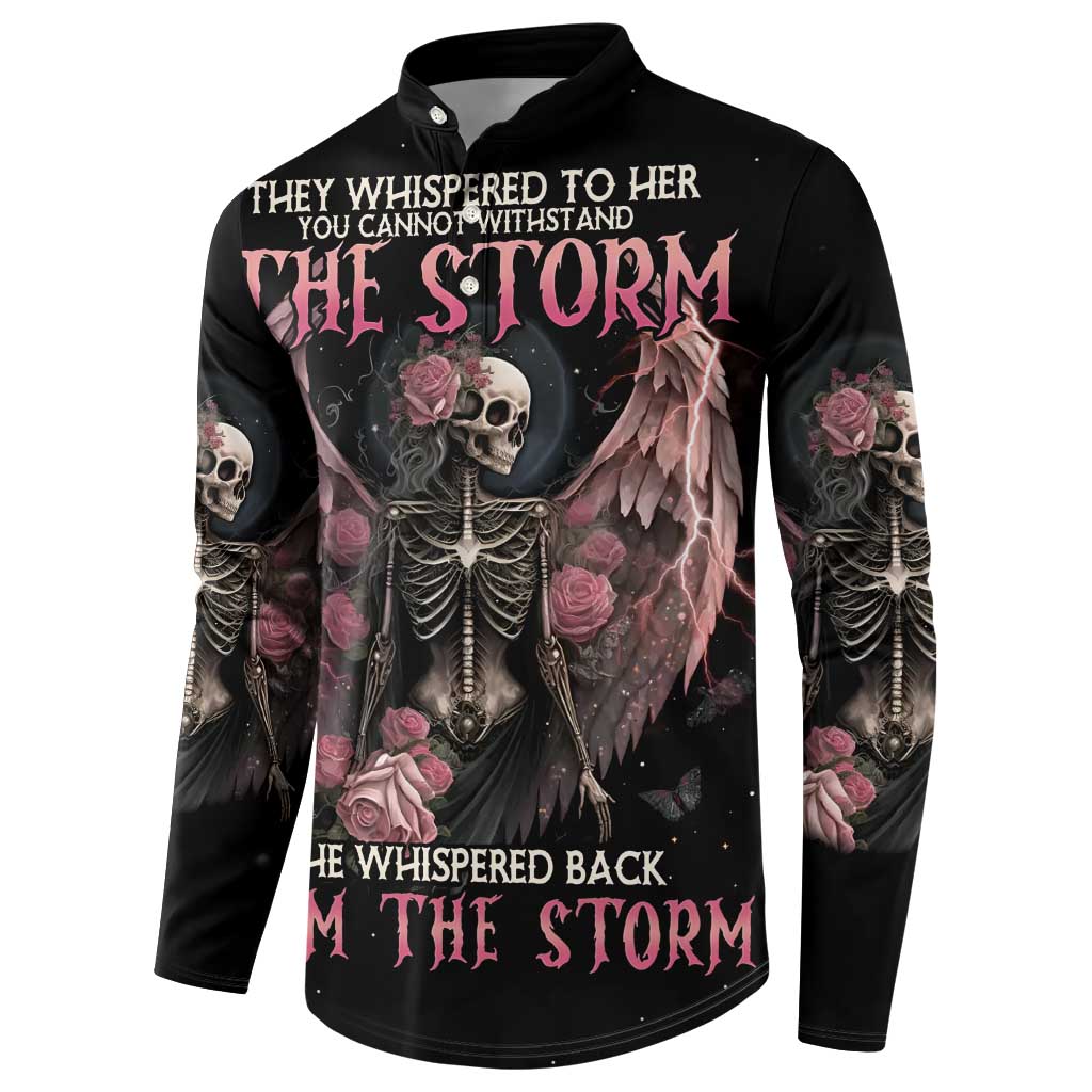 Black sweatshirt with central skull, winged artwork, pink roses, and long sleeve print