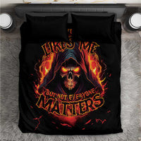 Black bedding set with reaper skull graphic and fiery text on duvet, matching pillowcases