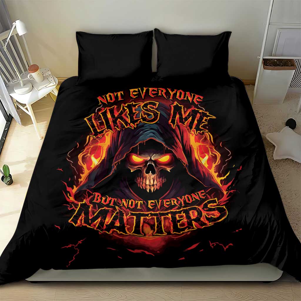 Black bedding set with flaming skull graphic and bright text on duvet, two matching pillow covers