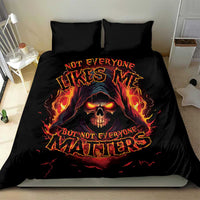 Black bedding set with flaming skull graphic and bright text on duvet, two matching pillow covers