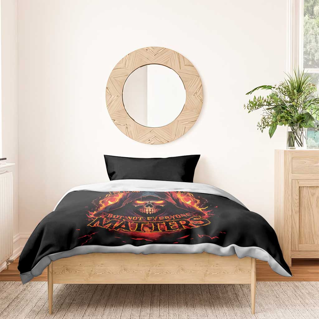 Black bedding set with flaming skull graphic and bold fiery text on duvet, matching pillowcase