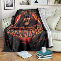 Black skull reaper graphic blanket with flaming skull and glowing red-orange lettering, draped