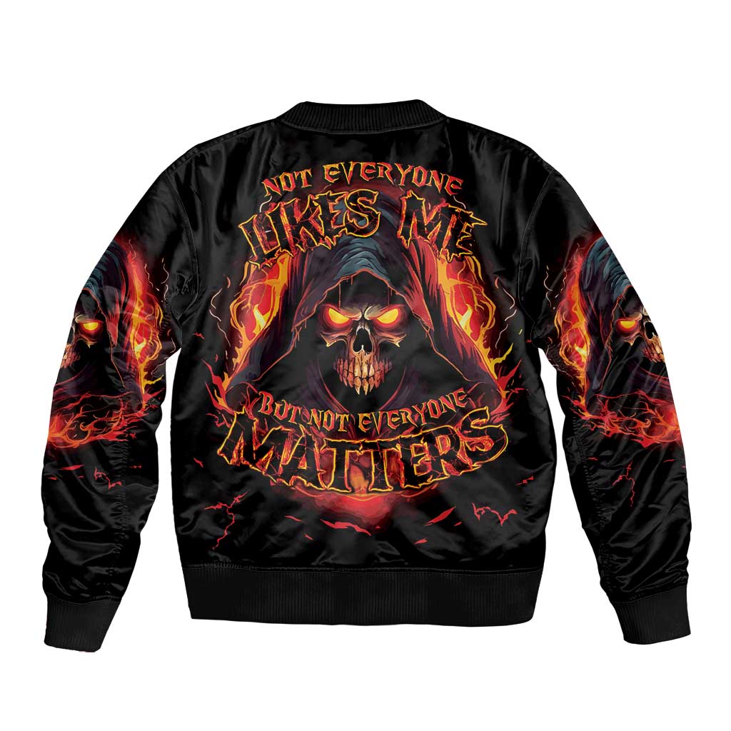 Black bomber jacket with back print featuring fiery skull and flames, ribbed hem