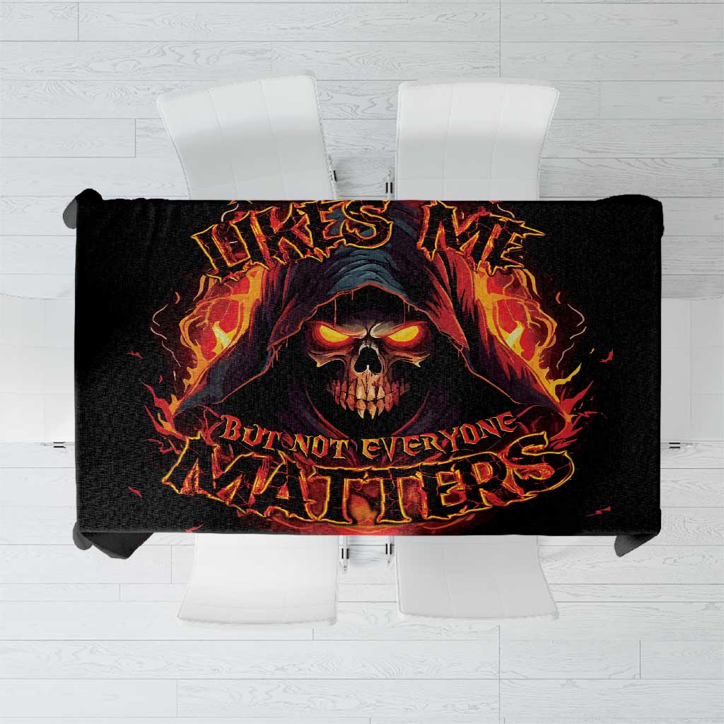 Black tablecloth with flaming skull reaper design and bold lettering, laid flat on chairs
