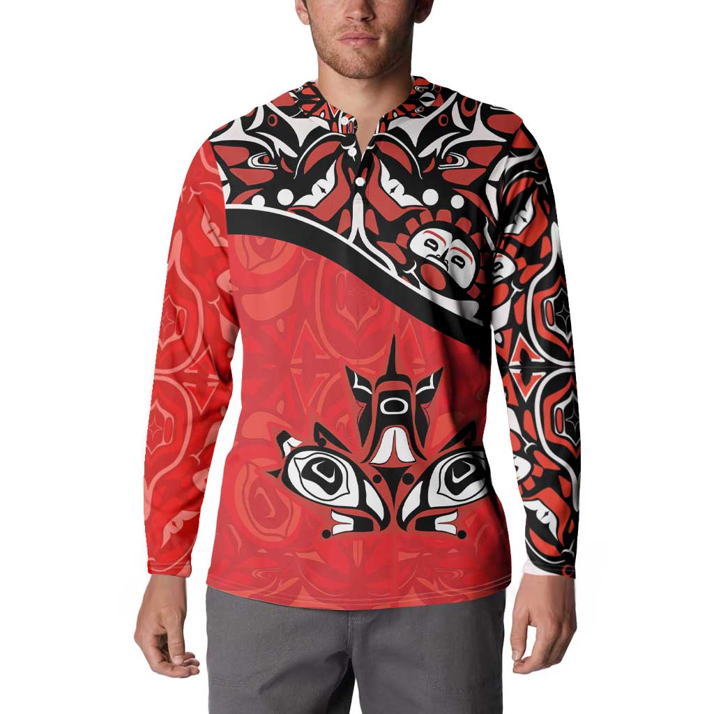 Red and black patterned button-up sweatshirt with large eagle-face artwork and diagonal stripe