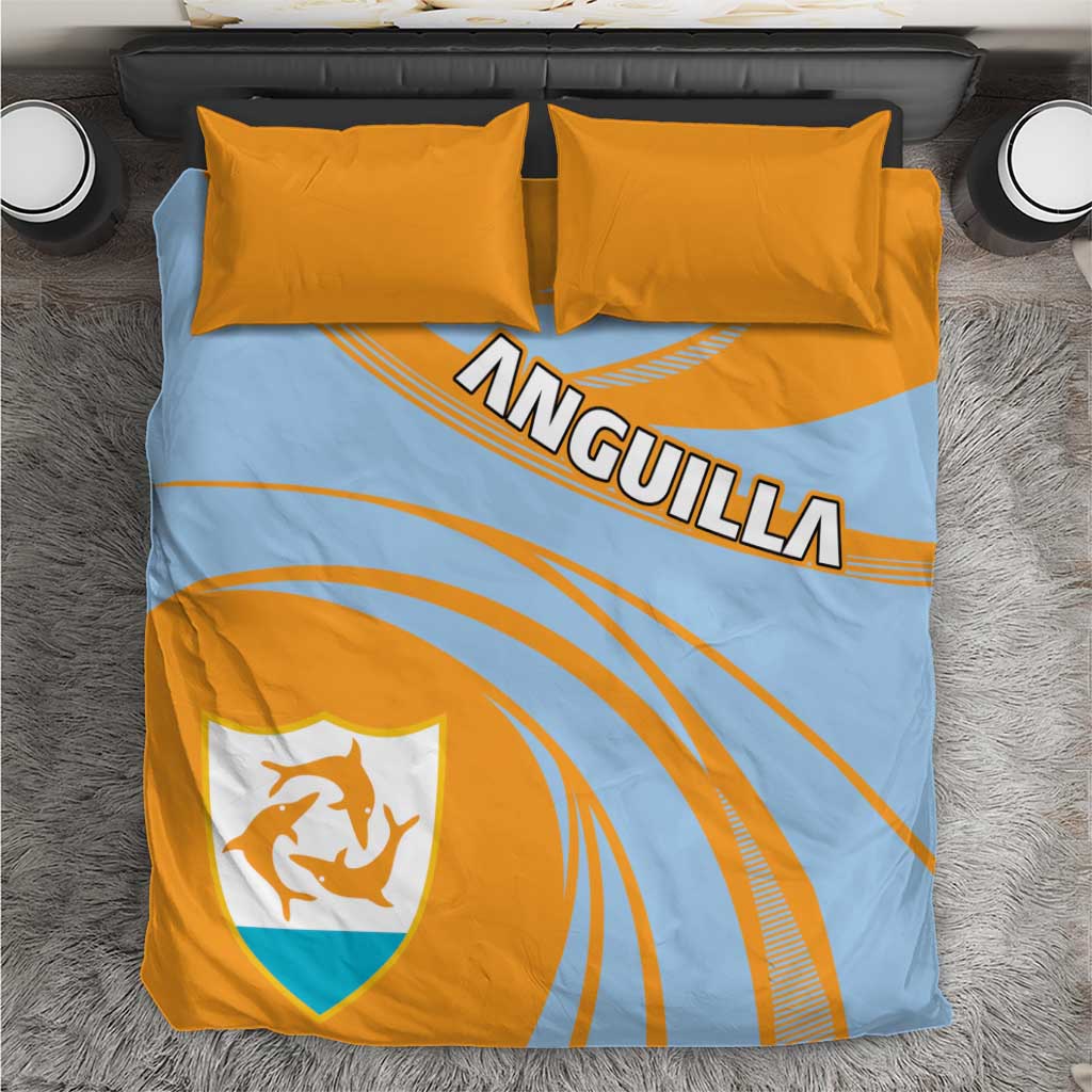 Light blue and orange bedding set with ANGUILLA print, crest shield, and two yellow pillows