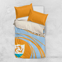 Light blue duvet with orange stripes and crest shield, paired with two yellow pillowcases