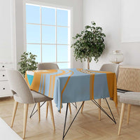 Blue and orange tablecloth with diagonal cricket stripes and coat of arms crest
