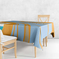 Blue and orange striped tablecloth with crest, corner drop and bordered edge