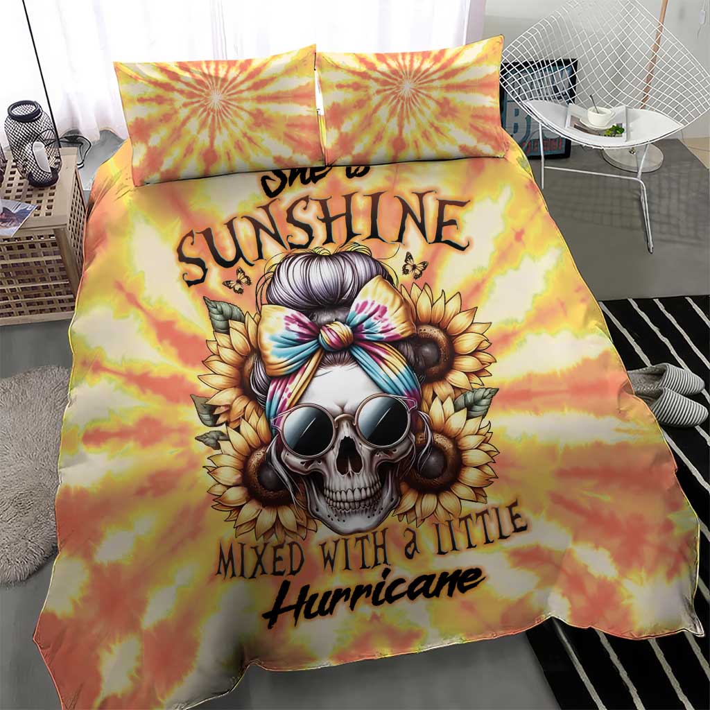 Yellow tie-dye duvet with skull and sunburst graphics, with two matching pillow covers